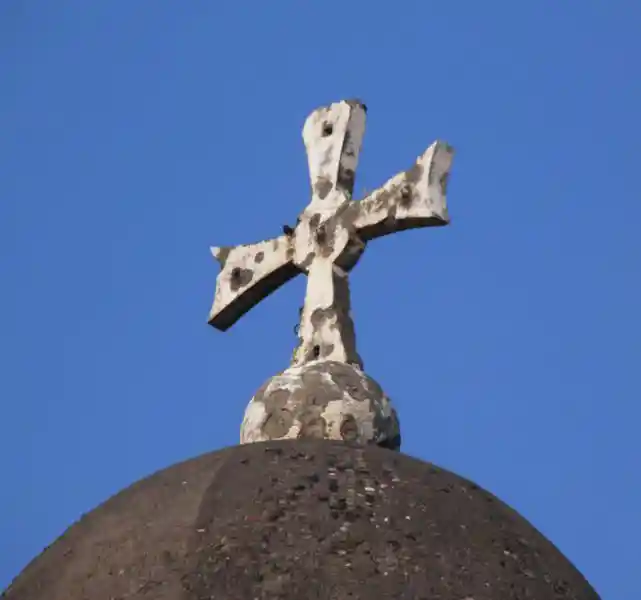 Cross with a circle in the center on top